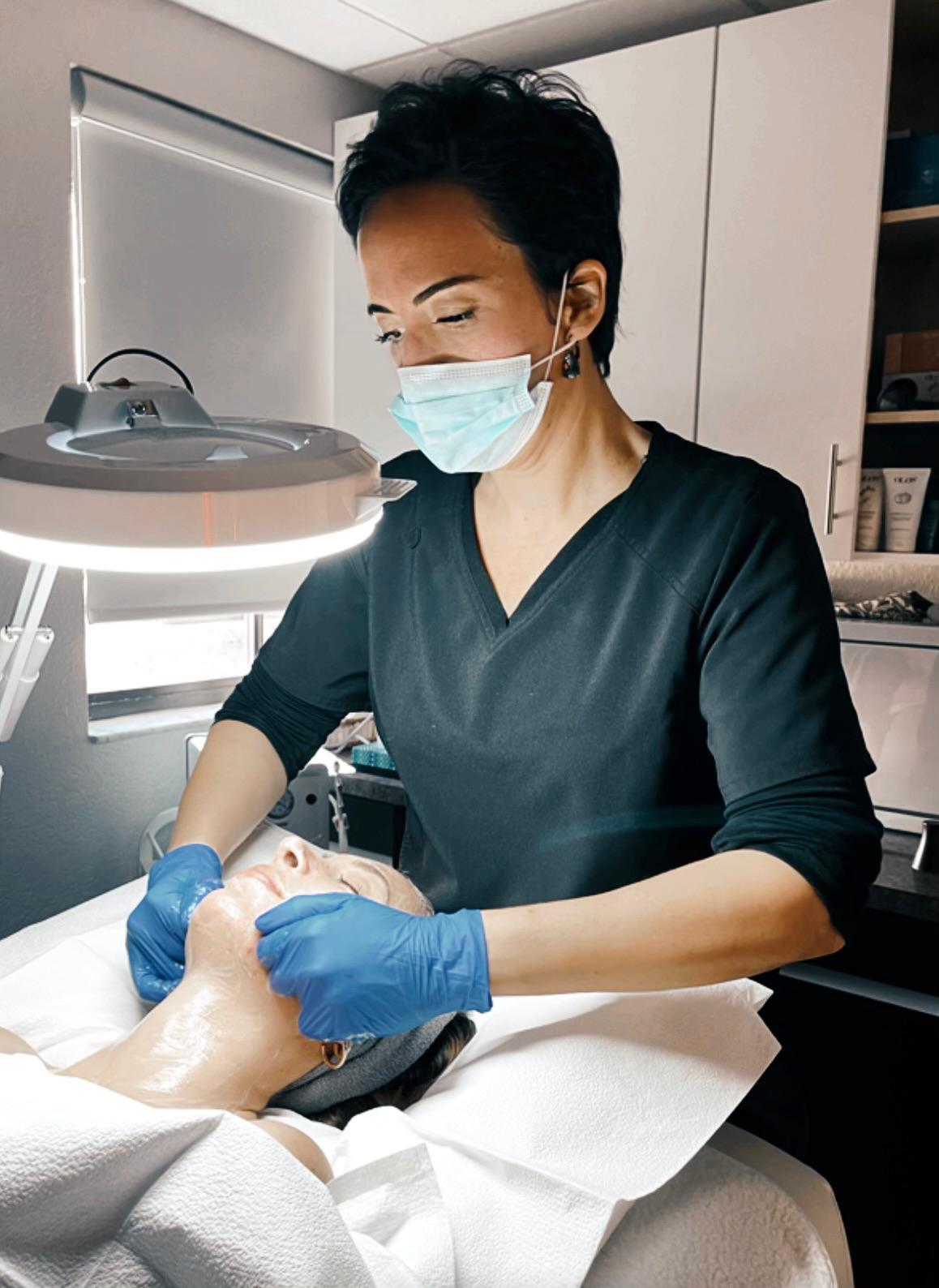 Skin examined closely under magnification to reassess progress